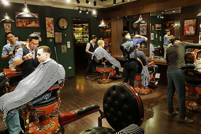 Barbers cutting in Hanoi
